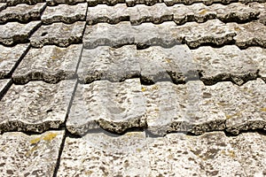 Texture of a gray roof made of old tiles. Roofing materials