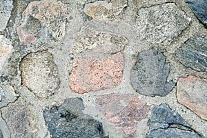 Texture of a gray stone wall. Old wall Stone wall as a background. Part of a stone wall, for a background