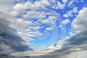 Texture of gray white clouds on a blue sky, background