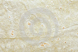 Texture of green thin Armenian lavash as background, top view