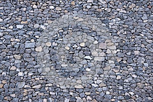 Texture of a grey granite stone wall for background