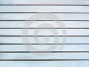 Texture of the grubby white wooden boards. The surface wood paneling pattern. The top view of the grubby white wood paneling