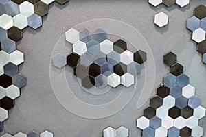 Texture of hexagonal metal tiles in gray and black, background