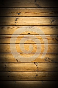 Texture of horizontal wooden panels, wall of yellow boards, abstract background