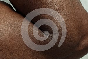 Texture of human skin. Close up of african-american male body