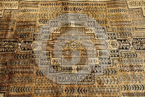 Texture of indian traditional wool carpet with geometric pattern