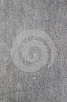 Texture of the inner side of a gray denim fabric with stains