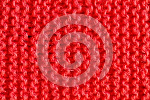 Texture of knitted red cloth.