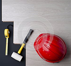 Texture laminate and tools with a red helmet