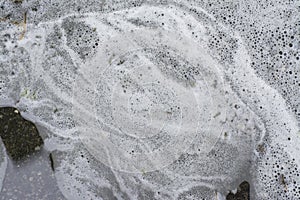 Texture of laundry bubble water on the ground surface