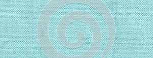 Texture of light blue color background from textile material with wicker pattern, macro. Vintage sky fabric