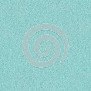 Texture of light blue felt. Seamless square background, tile ready.