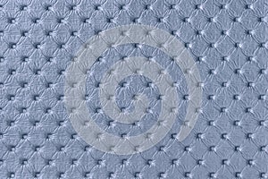 Texture of light blue leather background with capitone pattern, macro