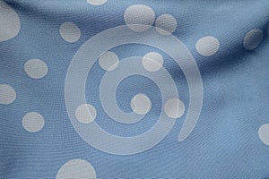 Texture of blue rayon fabric with polka dot pattern photo