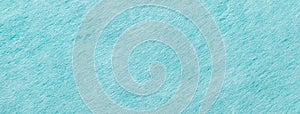 Texture of light blue and turquoise color background from felt textile, macro. Vintage cerulean fabric cloth