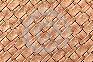 Texture of light brown and beige leather background with wicker pattern, macro