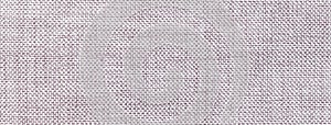 Texture of light gray color background from textile material with wicker pattern, macro. Vintage grey fabric