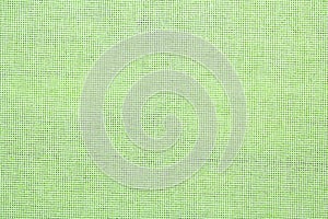 Texture of light green burlap fabric as background, top view