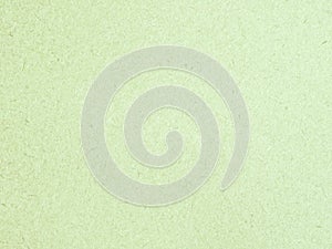 Texture of light green cardboard closeup, abstract paper background