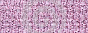 Texture of light lilac color background from woven textile material with wicker pattern, macro