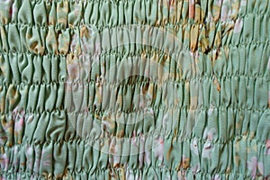 Texture of mint green rayon fabric with shirring photo