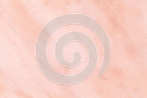 Texture of light pink marble with white lines of a pattern, macro background. Pastel rose color stone backdrop