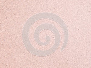 Texture of light red cardboard closeup, abstract paper background