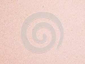 Texture of light red cardboard closeup, abstract paper background