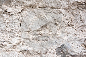 The texture of a light stone wall that partially collapses. Background for the banner. The basis for design