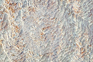 Texture of lime deposits on limestone hills of Pamukkale thermal springs
