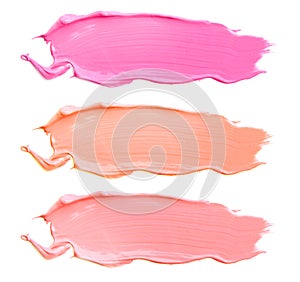 Texture of the lipstick of different colors isolated on white background. Set of multicolored strokes. Cosmetic product