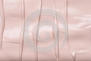Texture of liquid foundation cream background close up