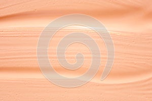 Texture of liquid foundation.Makeup foundation smudges on background