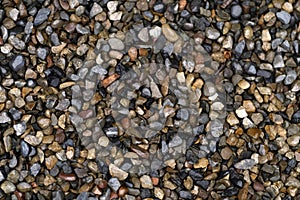 Texture of little wet stones in the rain, background
