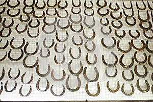 Texture, lots of horse horseshoes.Historic museum. The work of a blacksmith.