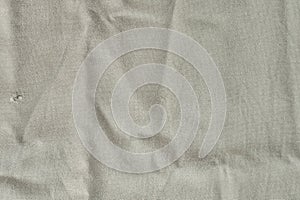 Texture of lused ight gray organic linen fabric closeup