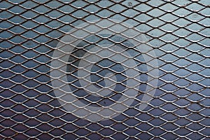 Texture of metal expanded lath. with iron plate background