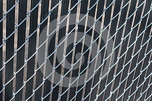 Texture of metal fencing in a diamond pattern