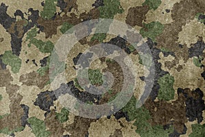 Texture of military dirty camouflage fabric. Combat protective camouflage for background