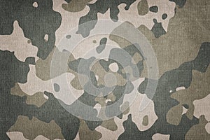 Texture of military dirty camouflage fabric. Combat protective camouflage for background