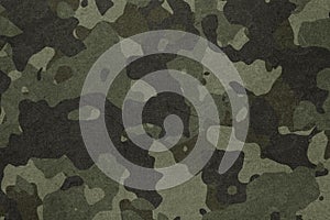 Texture of military dirty camouflage fabric. Combat protective camouflage for background