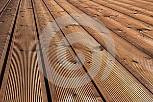 Texture of milled wooden boards made of wood. Abstract background, floor perspective view