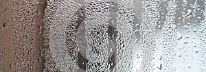 The texture of a misted glass with a lot of drops and condensati