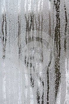 The texture of a misted glass with a lot of drops and condensati