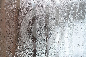 The texture of a misted glass with a lot of drops and condensati