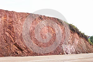 Texture of mountain showing red soil after excavated