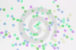 Texture with multicolored stars on a white background