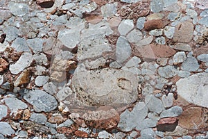 Texture of natural conglomerate clastic sedimentary rock background.