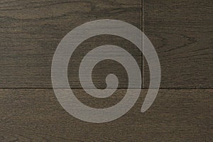 Texture of natural dark oak parquet close-up. Wooden boards for polished laminate. Hardwood sample background