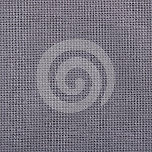 Texture of natural linen fabric close up. Gray dark linen textile